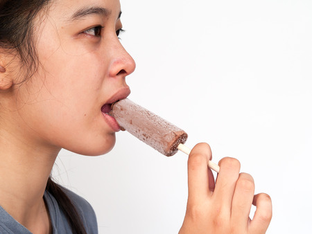 Pretty girl eating ice creamの写真素材