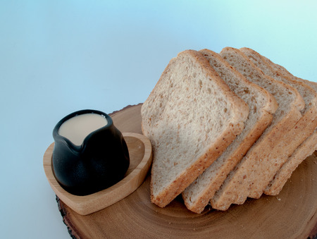 fresh milk and bread as a snack in the morning.