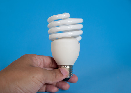 light bulb  , white on a blue background.の写真素材