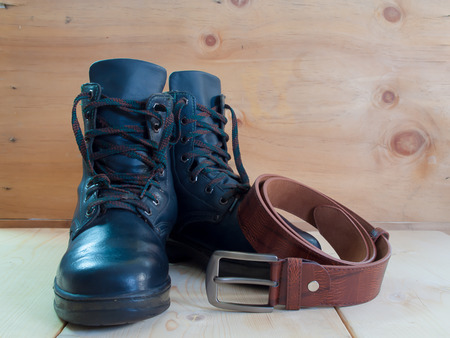 Shoes, belts , Placed on a wooden table.の写真素材