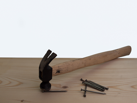 Hammer and Nail , Placed on a wooden table.の写真素材