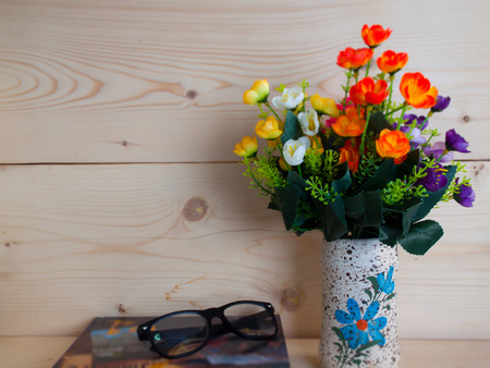 Glasses and educational texts  Vintage Image , On a background of brown wood.の写真素材