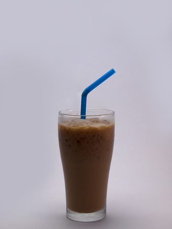 Iced coffee in long glass , Put on a white background.の写真素材