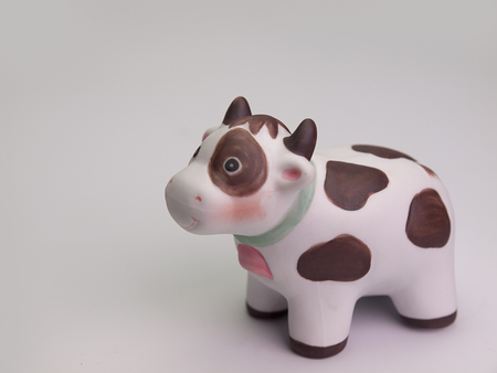 Toy cow isolated on a white backgroundの写真素材