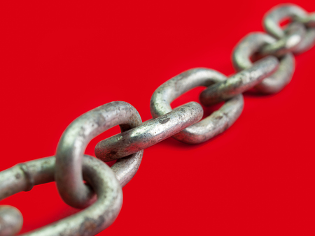 Close up Old Chains , Placed on a red background.