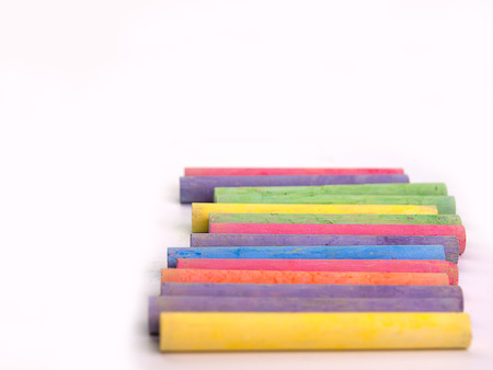 chalks in a variety of colors , Placed on a white background. (Space for placing text)の写真素材