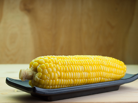 Close up ,Grains of ripe corn,Placed on a wooden floor.の写真素材