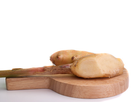 fresh ginger ,Placed on a wooden floor ,white background.の写真素材
