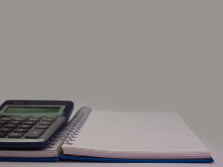 Book and calculator  , Placed on a white background. (with text space)