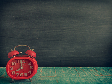 Blackboard, and watches, on the table in the classroom. (vintage)の写真素材