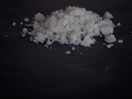 white salt on black background , (with free space for text)の写真素材