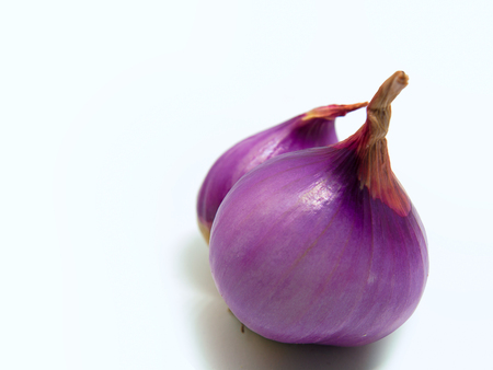 Fresh organic red shallot  On a white background.の写真素材