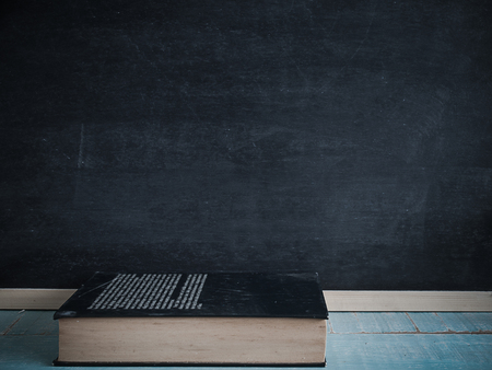 Blackboard and books , on the table in the classroom.の写真素材