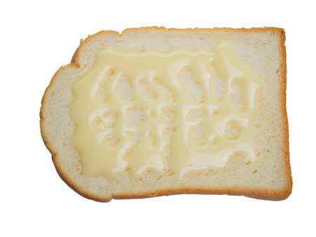 Sweetened condensed milk and breads , isolated on white background. (clipping path)の写真素材