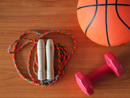 Jump rope with a basketball and dumbbell , Sports Equipment. Healthy Workout Concepts.の写真素材