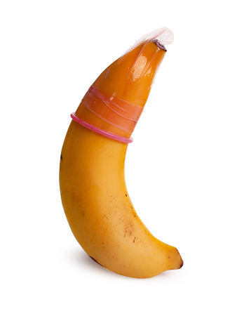 Condom on banana against , Safe sex concept. isolated on white background. (clipping path)の写真素材