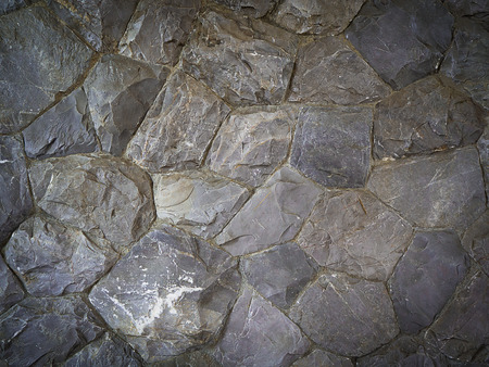 part of a stone wall , for background or texture.