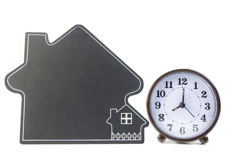 clock and home model. concept and idea of time value and money. (business concept sign, symbol, idea)の写真素材