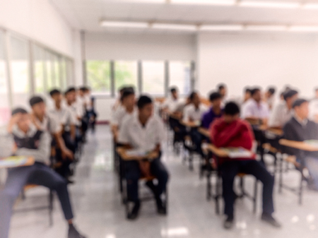 Students in class. Blur back view abstract background.の写真素材