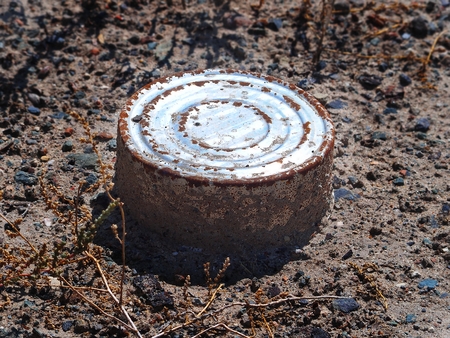 Rusty can of fish in yard of an abandoned fishing factory, Moynaq, Uzbekistanの写真素材