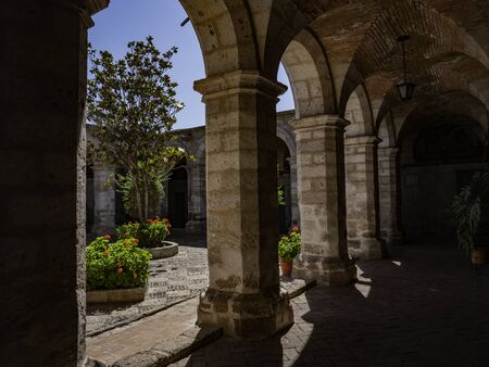 Inner courtyard and colonial-style passageway with decorated arches and columns. Saint Catherine...