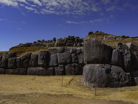 Huge carved and perfectly fitted stone blocks form the walls of the different levels of the Sacsayhuaman fortress, Cusco, Peruの写真素材