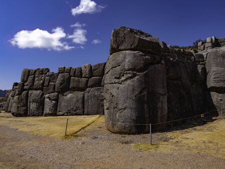 Carved, polished and perfectly rounded stone blocks form the inca walls of Sacsayhuaman, Cusco, Peruの写真素材