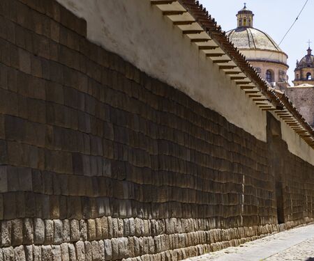 Old walls of the ancient city of Cusco today support Jesuit Church (church of the Society of Jesus), Cusco city, Peruの写真素材