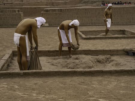 Human figures representing how they build buildings based on clay block constructions in ancient Huaca Pucllana. Lima city, Peruのeditorial素材