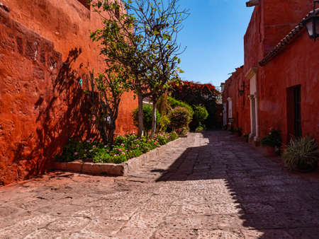 Traditional spanish style in an inner courtyard with red walls. Saint Catherine Monastery, Arequipa city, Peruのeditorial素材