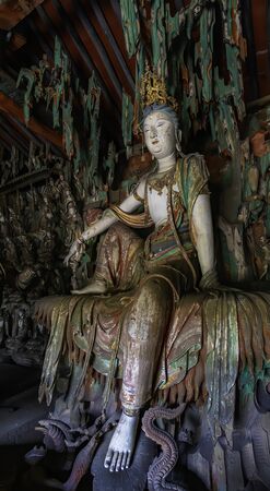 Supreme wood carving of bodhisatta statue. Avalokitesvara sculpture. Finest chinese art at Shuanglin...