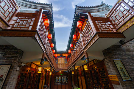 Old chinese house with traditional style. Typical balconies and Chinese lanterns. Pingyao Ancient City, Shanxi province, Chinaのeditorial素材