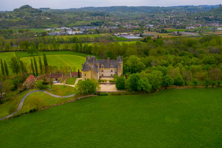 Aerial view of the Château de Montal (Castle of Montal) in spring. Castle is surrounded by beautiful green meadows Dordogne Valley, Lot department, southern France.のeditorial素材