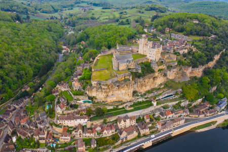 Aerial landscape. Ancient medieval Castle of Beynac stands on a top of a hill over the Dordogne river. Beynac et Cazenac is a village labeled Most beautiful villages of France.のeditorial素材
