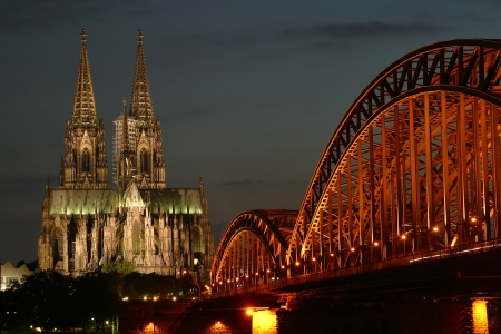 Cologne Cathedral and Train Bridge at nightの写真素材