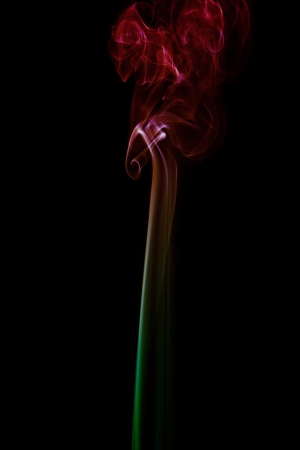 Colored Smoke on black backgroundの写真素材