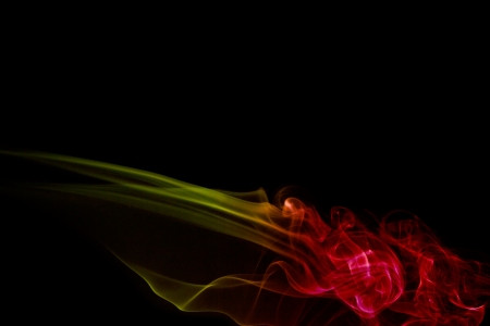 Colored Smoke on black backgroundの写真素材