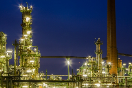 An illuminated chemical plant at nightの写真素材