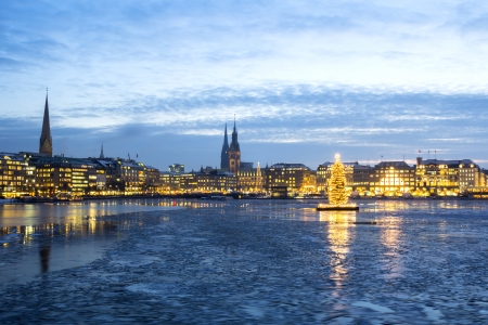 The Hamburg Alster lake with ice and Christmas tree in Adventの写真素材
