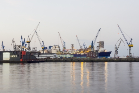 Shipyard with dock ship and cranes in the port of hamburgのeditorial素材