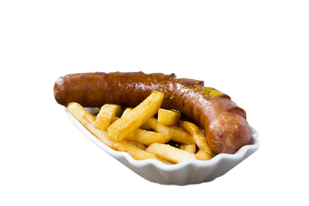 Popular German Fastfood (Saussage with Curry Sauce) Currywurst and French Fries isolated on white Backgroundの写真素材