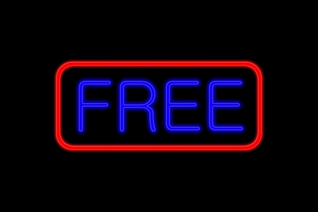 Illuminated Neon sign with blue Letters and red frame showing free isolated on black backgroundの写真素材