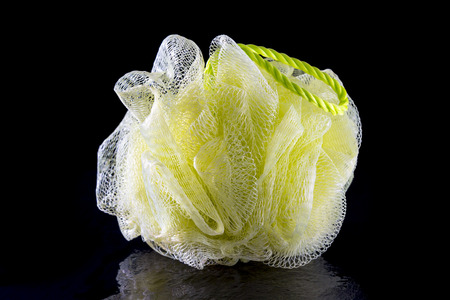 Yellow Bath Sponge on blackの写真素材