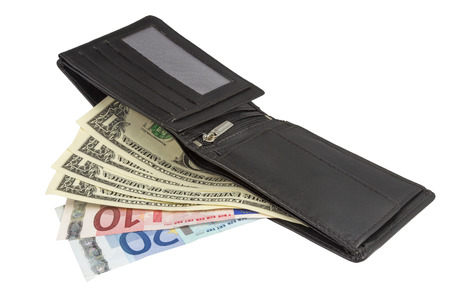 Purse of an International Traveller wirt US Dollars and Euro Currency isolated on white backgroundの写真素材