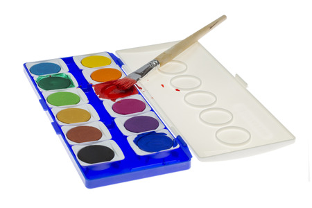 Used Paintbox with brush at the red colour isolated on white の写真素材