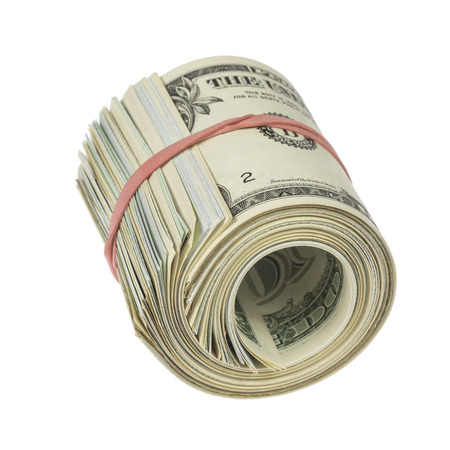 Roll of one dollar notes with red rubber band isolated on white の写真素材