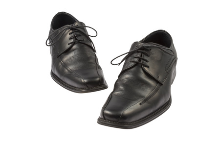 a Pair of Black Leather man Shoes isolated on white backgroundの写真素材