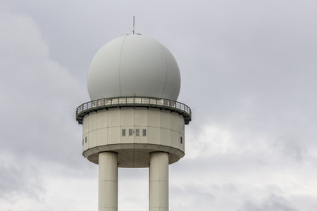 Radar Tower on gray cloudy skies