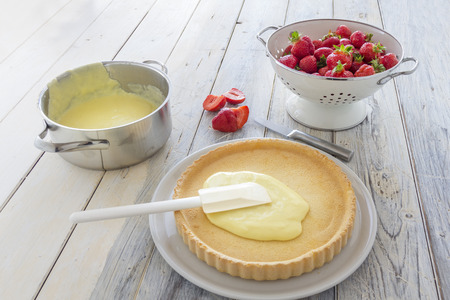 Prepareing a homemade strawberry cake の写真素材
