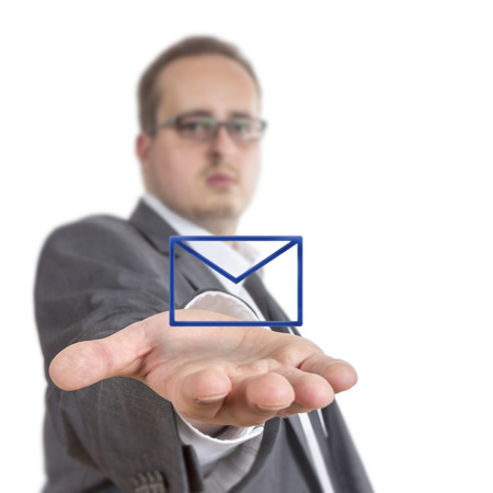 Business man reaches out his arm with an envelope symbol floating over his hand. Isolated on White Backgroundの写真素材